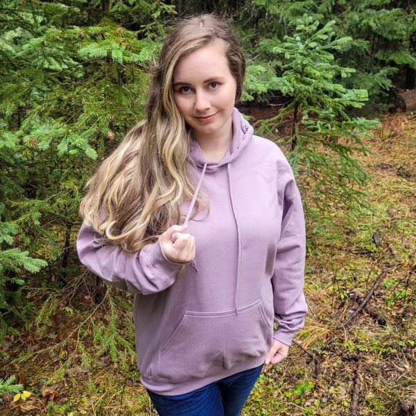 Girl in forest wearing hoodie