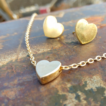 Small gold-colored heart pendant with small gold-colored heart earrings