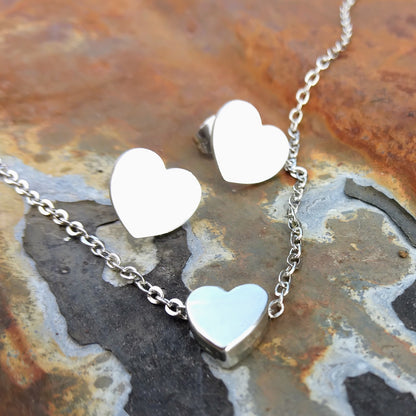 Small silver-colored heart pendant with small silver-colored heart earrings